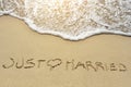 Just married written on sand beach near sea Royalty Free Stock Photo