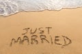 Just married written in the sand, tropical beach, honeymoon travel Royalty Free Stock Photo