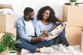 Just married couple choosing walls colour for new apartment