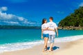 Just married young happy loving couple having fun on the tropical beach Royalty Free Stock Photo