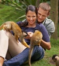 Just monkeying around. a young couple spending time at an animal sanctuary. Royalty Free Stock Photo