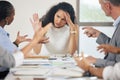 Just one moment of quiet please. a businesswoman looking stressed during a meeting.