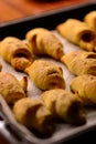 Just out of the oven, freshly baked mini croissants with a crispy crust