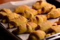 Just out of the oven, freshly baked mini croissants with a crispy crust