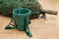 Just purchased Christmas tree lying on the floor next to a plastic stand