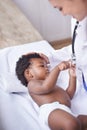 Just in for a routine pediatric checkup. a female pediatrician doing a checkup on an adorable baby boy. Royalty Free Stock Photo