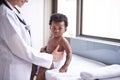 Just in for a routine pediatric checkup. a female pediatrician doing a checkup on an adorable baby boy. Royalty Free Stock Photo