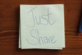 Just Share written on a note Royalty Free Stock Photo