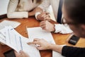 Just sign here and the house is yours. Over the shoulder shot of an unrecognizable couple negotiating with a real estate