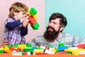 Just smile. building plane with constructor. small boy with dad playing together. happy family leisure. love. child