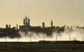 Just before sunrise a view of an oil and gas refinery creates an eerie silhouette.