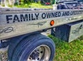 Family owned business signage on a tow truck