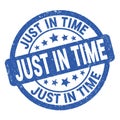 JUST IN TIME text written on blue round stamp sign Royalty Free Stock Photo