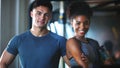 Just two fitness fanatics. Portrait of two sporty young people at the gym. Royalty Free Stock Photo