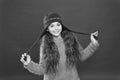 Just want to have fun. Winter outfit. Cute model enjoy winter style. Small child long hair wear hat. Wintertime concept Royalty Free Stock Photo