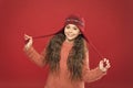 Just want to have fun. Winter outfit. Cute model enjoy winter style. Small child long hair wear hat. Wintertime concept