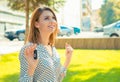 Woman celebrating driver holding key of her new car, automobile Royalty Free Stock Photo