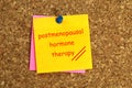 Postmenopausal hormone therapy postit on cork Royalty Free Stock Photo