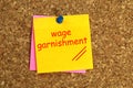 Wage garnishment postit on cork Royalty Free Stock Photo
