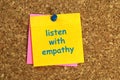 listen with empathy postit on corkboard