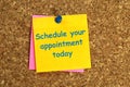 schedule appointment today postit on corkboard