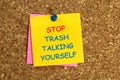 stop trash talking yourself postit on corkboard Royalty Free Stock Photo