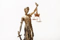 Justice blindfolded lady holding scales and sword statue