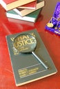 Justice Book And Magnifying Glass Royalty Free Stock Photo
