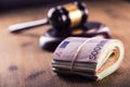 Justice and euro money. Euro currency. Court gavel and rolled Euro banknotes. Representation of corruption and bribery in the judi Royalty Free Stock Photo