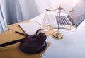 Justice and law concept.Male judge in a courtroom with the gavel, working with, computer and docking keyboard, eyeglasses, on Royalty Free Stock Photo