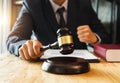 Justice and law concept.Male judge in a courtroom with the gavel,working with,digital tablet Royalty Free Stock Photo