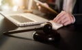 Justice and law concept.Male judge in a courtroom the gavel, working with digital tablet computer. Royalty Free Stock Photo