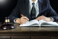 Justice and law concept.Male judge in a courtroom working on wood table with documents., attorney court judge justice gavel legal Royalty Free Stock Photo