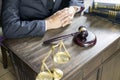 Justice and law concept.Male judge in a courtroom working on wood table with documents., attorney court judge justice gavel legal Royalty Free Stock Photo