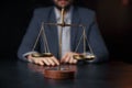 Justice and law concept.Male lawyer in the office with brass scale on wooden table,reflected Royalty Free Stock Photo