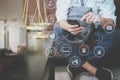 Justice and Law context.Male lawyer hand sitting on sofa and working with smart phone,digital tablet computer docking keyboard wi