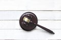 Justice mallet on a white wooden desk in a courtroom during a judicial trial. Law concept and empty copy space