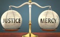 Justice and mercy staying in balance - pictured as a metal scale with weights and labels justice and mercy to symbolize balance
