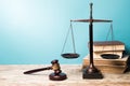 Justice Scales, books and gavel, close-up view Royalty Free Stock Photo