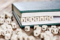 Justice word written on a wooden block. Royalty Free Stock Photo