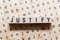 Justify word concept on cubes Royalty Free Stock Photo