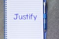 Justify write on notebook Royalty Free Stock Photo