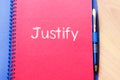 Justify write on notebook Royalty Free Stock Photo