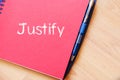 Justify write on notebook Royalty Free Stock Photo