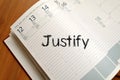 Justify write on notebook Royalty Free Stock Photo