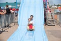 Justin Trudeau riding down slide