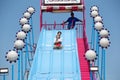 Justin Trudeau riding down slide