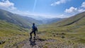 Juta - A male hiker enjoying the panoramic view to the Chaukhi massif in the Greater Caucasus Mountain Range in Georgia.