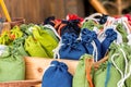 Jute pouch of grass sachets natural eco materials. Blue small blue green bags close-up Royalty Free Stock Photo