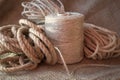 Jute rope and spools of burlap threads or twine Royalty Free Stock Photo